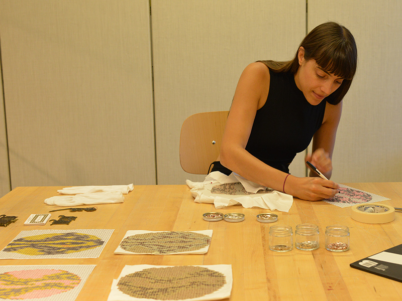 Mallory Weston working in the Museum of Arts and Design