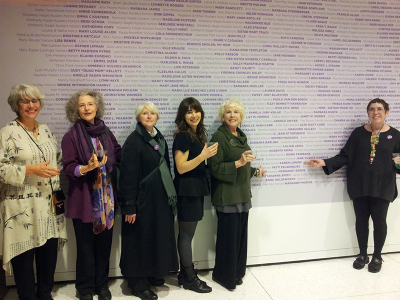 Facèré staff—(left to right) Nancy Mēgan Corwin, Dana Shaw, Susan Welch, Madeline Courtney (Maddy), Lorraine Vagner, and Karen Lorene—standing in front of the Seattle Art Museum’s Wall of Women, 2012