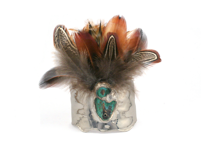 Jim Cotter, Mask Bracelet, 2014, sterling silver, bronze, feathers, 102 x 102 x 127 mm, photo: J. Cotter Studio Jim Cotter, Mask Bracelet