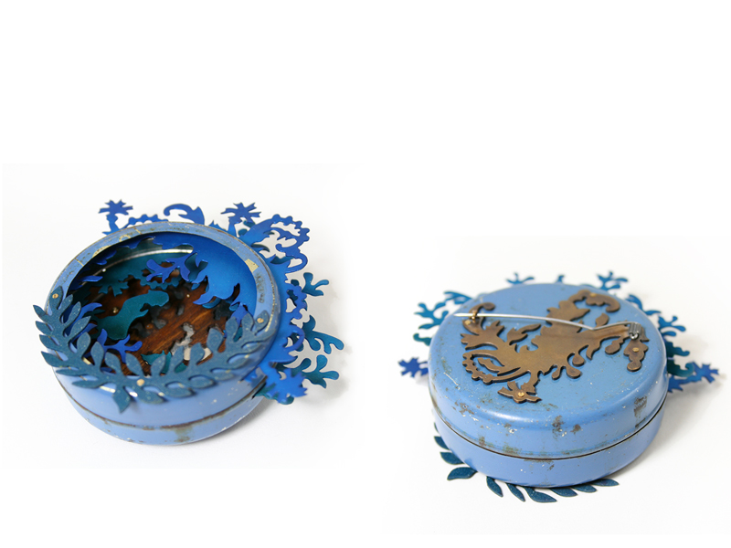 Anna Talbot, Blue Wolf (front and back view), 2012 brooch, old box, anodized aluminum, brass, wood veneer, steel, 80 x 80 x 20 mm, private collection, photo: artist