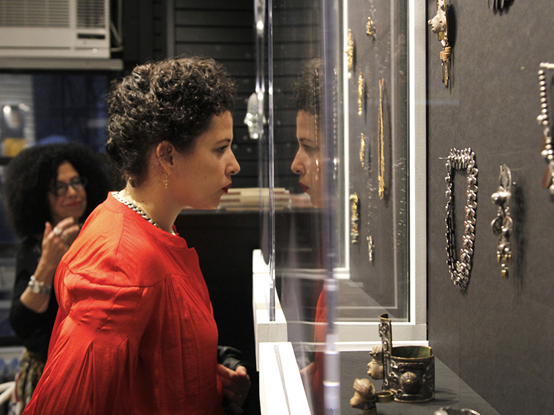 A visitor to The Jewelry Library during the Dreaming in Silver exhibition of Mexican jewelry, photo courtesy Karen Davidov, The 
