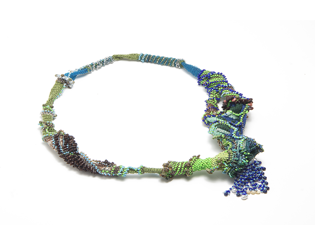 Sébastien Carré, I Am a Landscape, 2018, necklace, green garnet, agate, malachite, turquoise, lapis lazuli, hyolite, shell, natural pearls, seed beads, photo copyright Milo Lee. Included in the Beaded exhibition, curated by Catarina Silva and held at Institut Français in Munich during Munich Jewellery Week 2020. Sébastien Carré, I Am a Landscape, 2018