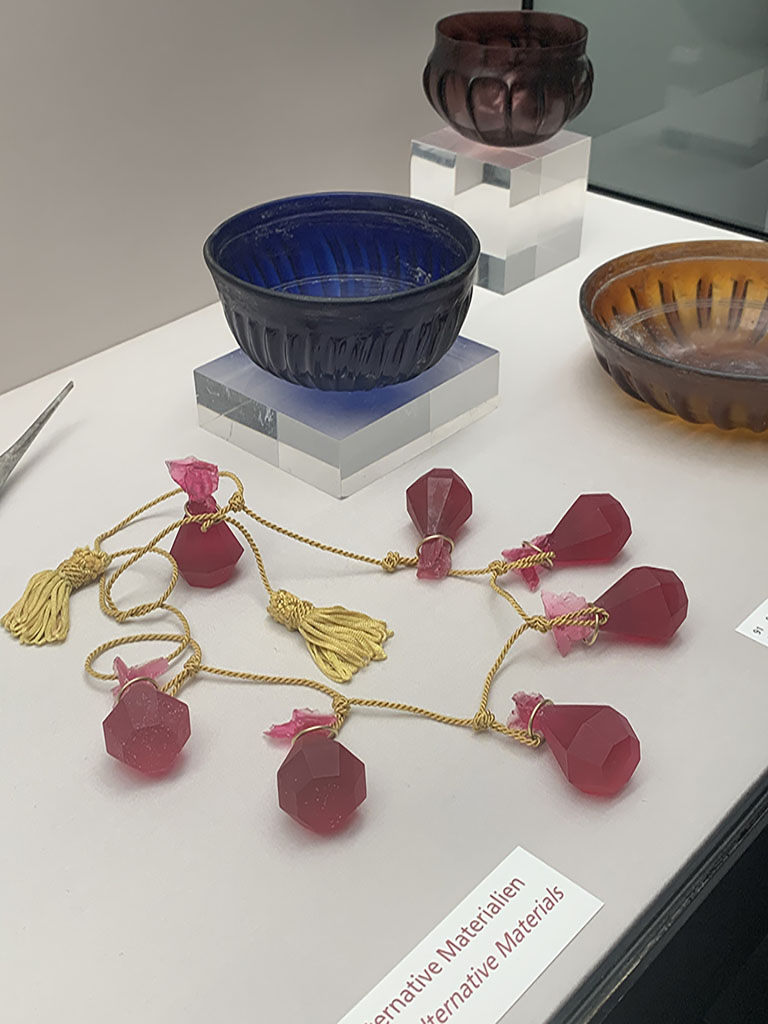 Exhibition view, Works and Days, Danish Arts Foundation at Staatliche Antikensammlungen Museum, during Munich Jewellery Week 2020, photo: Pei Wu. Contemporary art from Denmark meets ancient artifacts in the State Collection of Antiquities at Munich, through June 14, 2020. Exceptional Danish jewelry made between the 1970s and the present interacts directly with ancient art from the Munich collection. On display: 100 contemporary pieces of jewelry created by about 50 Danish designers. The 13 subject areas of the special exhibition are based on Works and Days by the seventh-century BCE Greek author Hesiod. Works and Days, Danish Arts Foundation during Munich Jewellery Week 2020