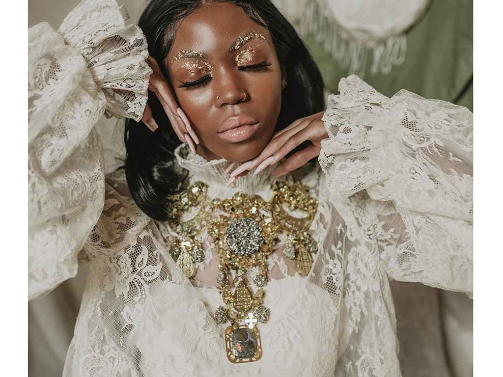 “The entire collection is hand cut/pierced, set, and fabricated,” says SCAD’s Jay H. Song, “yet utilized laser cutter for pattern making and laser welders for initial tacking prior to soldering, for precision. Like the combination of using traditional jewelry making with technology.” | Divya Raijada, A Glittering Experience, 2021, necklace, hand-pierced brass, pyrite, rose-cut glass, marcasite, model: @abbyblazee, set design: @jkchaotic, photo: @kayleighsclicks Divya Raijada, A Glittering Experience