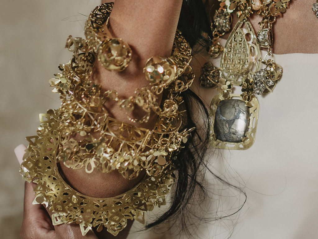 Divya Raijada, A Glittering Experience, 2021, bangles, (top to bottom) Kada, hand-pierced brass; Chuddi, hand-pierced brass; Gajra, hand-pierced brass and rose-cut glass; Chuddi, hand-pierced brass; Bangdi, hand-pierced brass; model: @abbyblazee, set design: @jkchaotic, photo: @kayleighsclicks Divya Raijada, A Glittering Experience