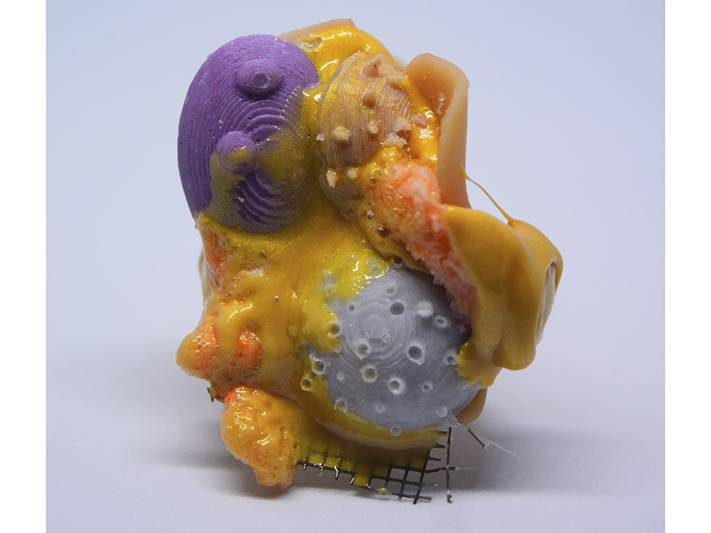 “The forms I've created emulate the organic forms seen in the ocean,” says Dickinson, “while the bright colors were specifically chosen to mimic those that occur naturally.” | Sckye Dickinson, Urchin Ring-Orange (detail), 2021, ring, rubber, silicone, mesh, clay, photo: artist Sckye Dickinson, Urchin Ring-Orange (detail)