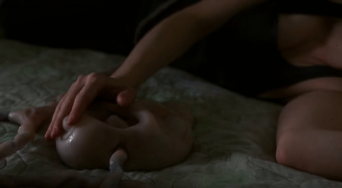 Allegra Geller (Jennifer Jason Leigh) stroking the game pod, eXistenZ, 1999