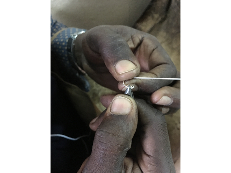An artisan demonstrates filigree during Karen Smith’s apprenticeship in Dakar, Senegal, photo courtesy of Karen Smith