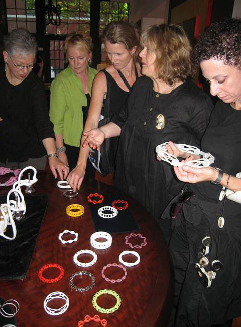 Group looking at jewelry by Anthony Tammaro