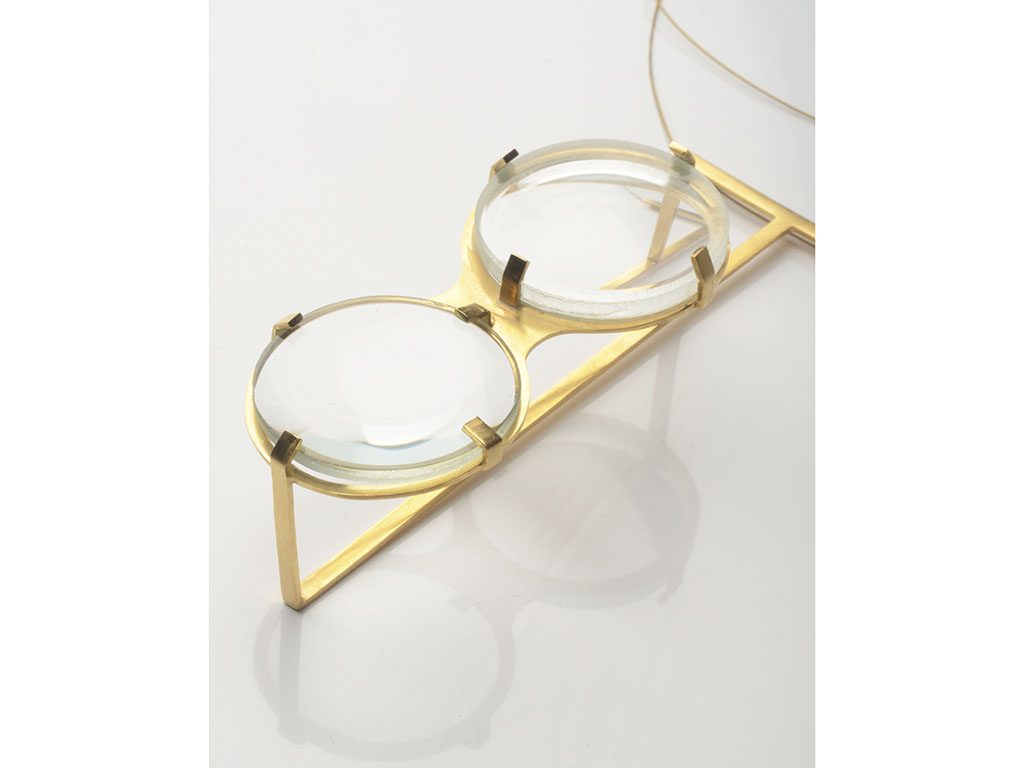 “Besides the distorting function the glass pieces obviously had,” says Timkova, “they also became the major decorative element in the jewelry, as if they were precious stones. The glass was framed and set in brass constructions, referring to the optical instruments we know from times past.” | Olha Timkova, brooch, brass, glass, stainless steel, 70 x 35 x 23 mm, photo: artist Work by Olha Timkova