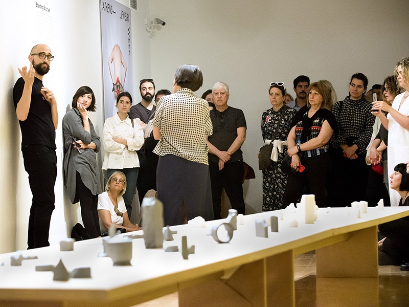 Museum visitors and AJW19 participants listen to the Artist Talk by invited artists Edu Tarin and Patricia Domingues, at the Benaki Museum, 2019, photo: Orestis Rovakis Museum visitors