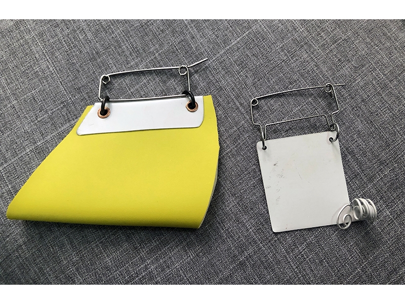 Heather Nuber Pin Swap pins in Maggie Smith’s collection; the yellow fibula pin is a 2019 Pin Swap; the swap date of the white fibula pin is unknown, photo: Kathleen Kennedy Heather Nuber Pin Swap pins