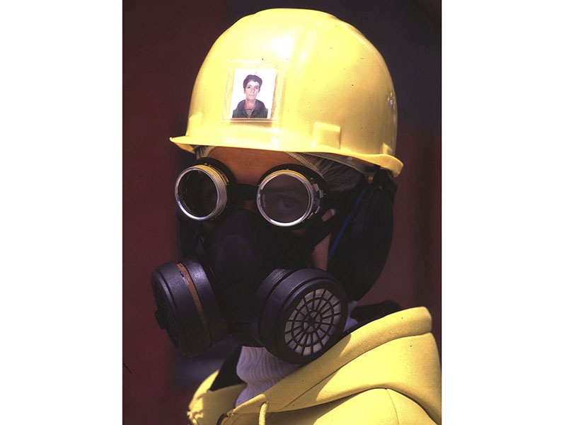 Marília Maria Mira (b. 1962), Provisions of Daily Life in the Year 2020, 1998, protective equipment including safety helmet, eye and ear protectors, respiratory equipment, gloves and safety boots; each protective object has its own box made of galvanized iron, modeled by the artist, photo: Manuel Portugal Marília Maria Mira, Provisions of Daily Life in the Year 2020