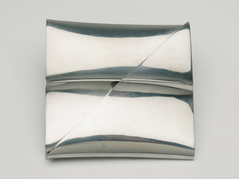Françoise van den Bosch, Untitled (Cushion Brooch), 1976, two-part brooch, pinched square aluminum tube, 55 x 55 x 25 mm, photo courtesy Françoise van den Bosch Foundation Françoise van den Bosch, Untitled (Cushion Brooch)