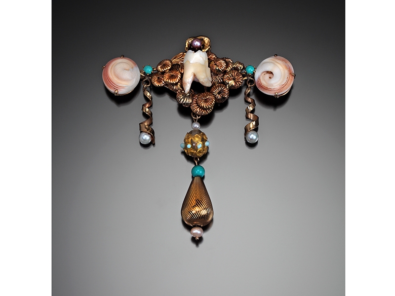 Nancy Worden, Venetian Vacation, 1986, 14-karat gold, turquoise, pearls, shell fragments, Venetian glass bead, the artist’s wisdom tooth, 18-karat gold crown, 89 x 89 mm, Bequest of the Estate of Mia McEldowney, Tacoma Art Museum, 2014.19.32, photo: Doug Yaple Nancy Worden, Venetian Vacation
