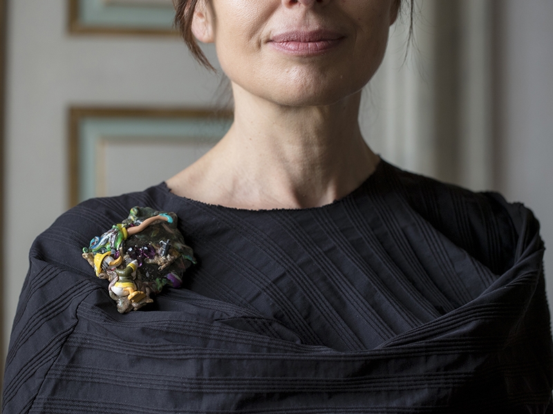 Barbara Uderzo, Fermento, 2017, brooch, different plastics, miniature character, leg and glass (objets trouvés), blackened silver moka, purple crystals, garnet, copper, steel, crystal, 90 x 70 x 25 mm, photo: Angela Petrarelli Isabella Ostelli Barbara Uderzo, Fermento