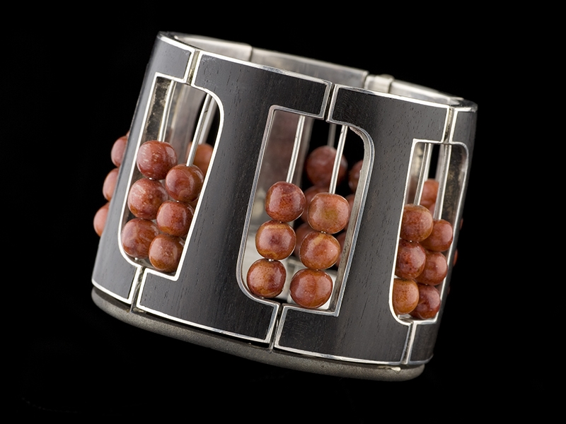 Bill Reid, Hinged “Abacus” Bracelet, 1960, sterling silver, ebony inlay, coral beads, 50 x 50 x 55 mm, SFU Bill Reid Collection, photo: Kenji Nagai Bill Reid, Hinged “Abacus” Bracelet