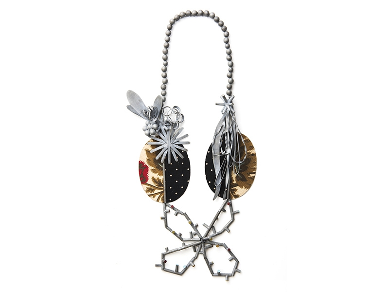 Lucy Sarneel, La Double Vie, 2009, necklace, zinc, nylon thread, antique textile on rubber, paint, 42 x 22 x 2 cm, photo: Guri Dahl Lucy Sarneel, La Double Vie