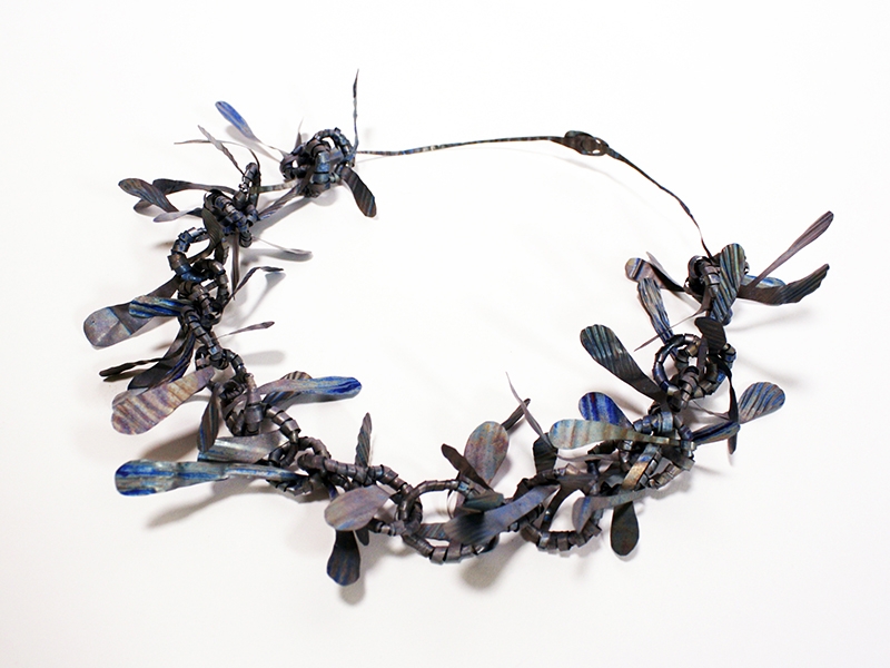 Andi Gut, 27 Flights, 2016, necklace, recycled airplane titanium, 250 mm in diameter, photo: artist Andi Gut, 27 Flights