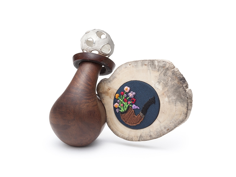 Josée Desjadins, Rencontre Impromptue 3, 2018, Brooch, turned sea-wood, sterling silver, brass, tapestry, fragment of night blue taffeta dress, embroidery and fragment of pipe, 10 x 4 x 9cm, photo: Anthony McLean. Josée Desjadins, Rencontre Impromptue 3