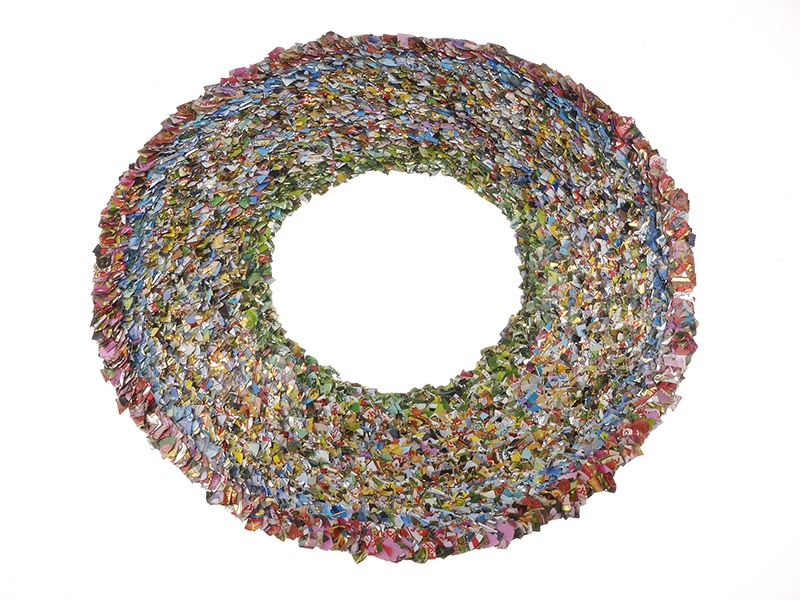 Verena Sieber-Fuchs, Deckelet Sie Au, 1995, foil, wire, coffee cream lids, 381 mm diameter, photo courtesy of Rotasa Foundation Verena Sieber-Fuchs, Deckelet Sie Au