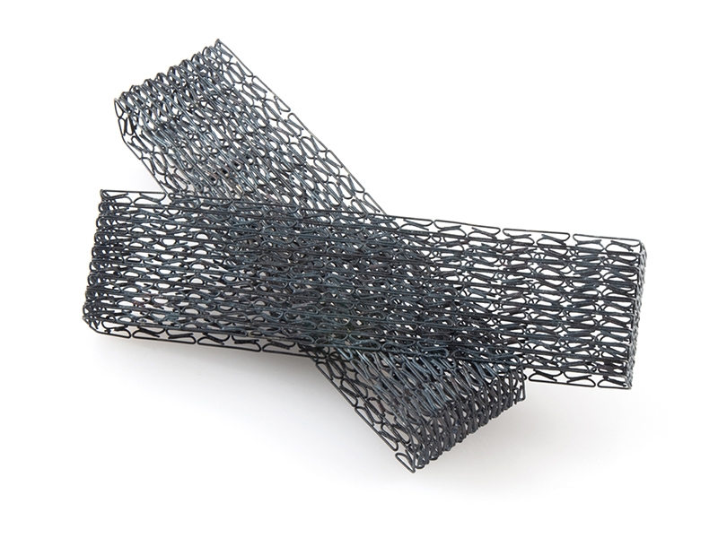 Jess Tolbert, Greater-Than Series #7, 2019, brooch, staples, steel, 14-karat gold, 100 x 120 x 45 mm, photo: artist Jess Tolbert, Greater-Than Series #7