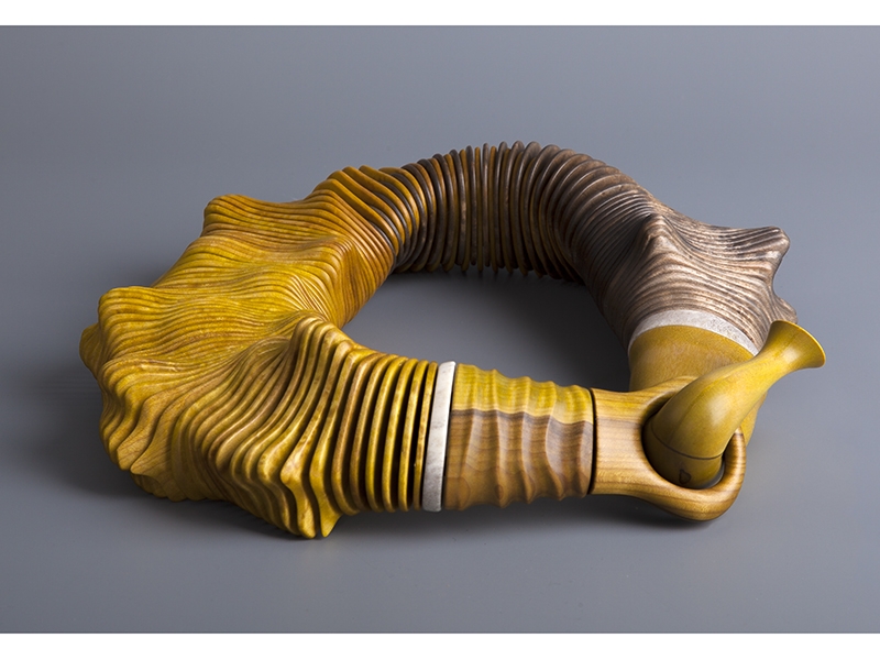 Liv Blåvarp, Voice of the Forest, 2013, stained birdseye maple, rowan, reindeer horn, brass discs, polyester cords, approximately 220 mm in diameter, photo: Audbjørn Rønning Liv Blåvarp, Voice of the Forest, 2013