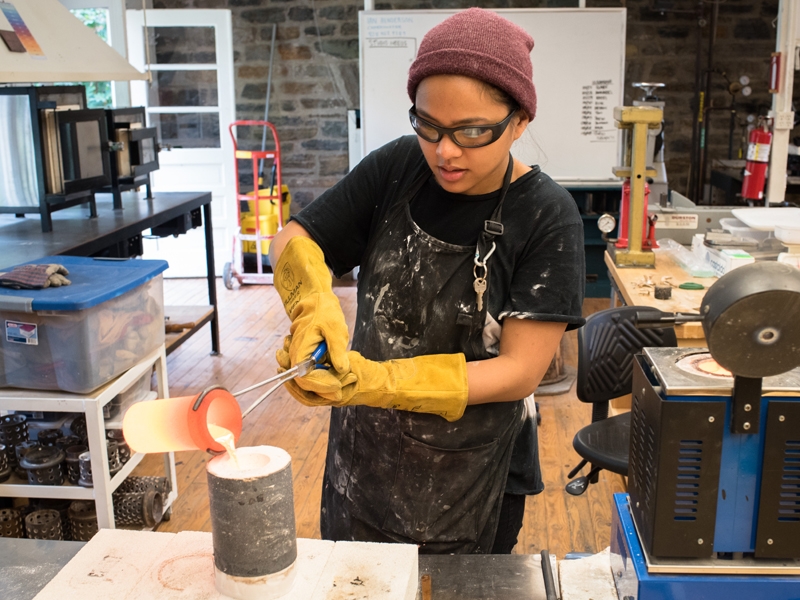 A student working on a casting project in the Penland metals studio, photo: Robin Dreyer A student working on a casting project