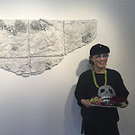 (On wall) Joseph Sivilli, ceramic relief, with Yun Gee Park holding Don Porcella’s pipe cleaner skull, photo courtesy of Yun Gee Park Gallery
