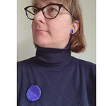 "Aline Vandeplas wearing earrings by Akiko Kurihara and a brooch by Karin Seufert"