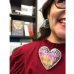 "Yvonne Montoya wearing Ana Margarida Carvalho’s earrings and Mallory Weston’s Prismatic Spiky Heart Pin"