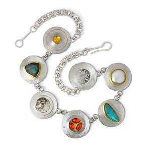 Linda Perry, Seven Silver Circles I, necklace, opals, pearl, tourmaline, lab-created yellow sapphire and mother-of-pearl doublet, silver, 22-karat gold, photo courtesy of the artist

