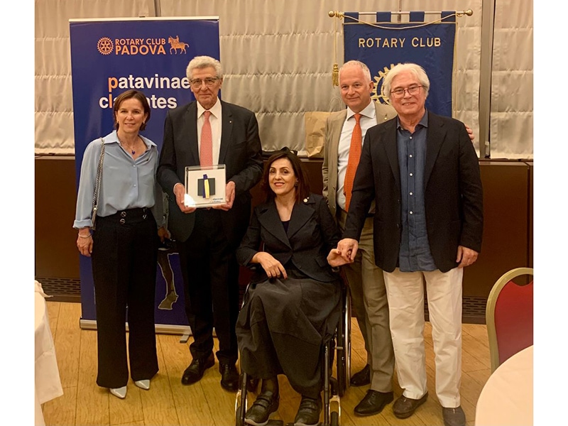 Annamaria Zanella (at center) and Renzo Pasquale (far right)at a Rotary Club Padova meeting