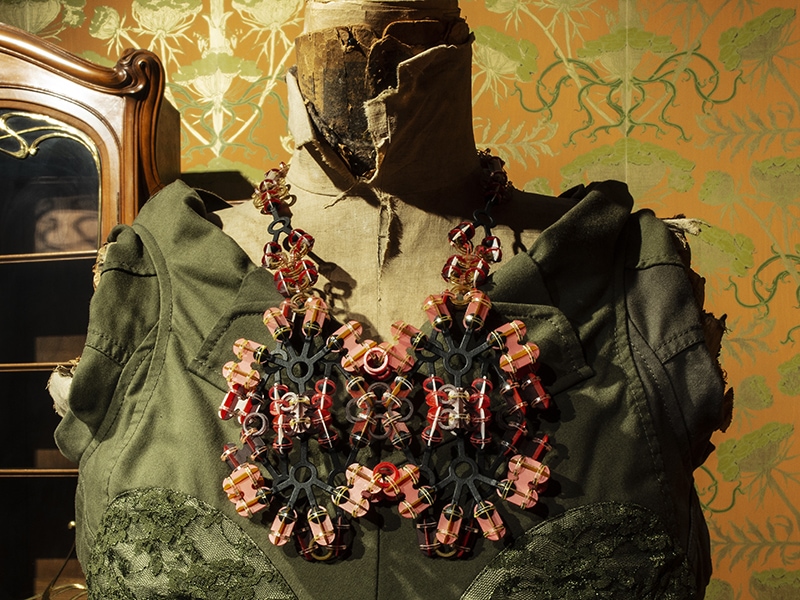 Exhibition view, Jewellery & Garment. Jewelry: Svenja John, Boise, 2018, necklace, polycarbonate, nylon, acrylic paint. Garment: Junya Watanabe, dress made from old military clothing, 2006, cotton