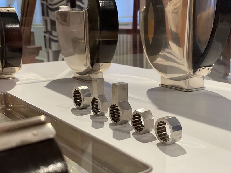 Exhibition view, Jewellery & Garment. Peter Skubic, Untitled, 2018, rings, revised new edition based on unique hand-cut pieces from 1976/1977, stainless steel. The rings are displayed in dialogue with a German Art Deco coffee and tea set from the early 1930s