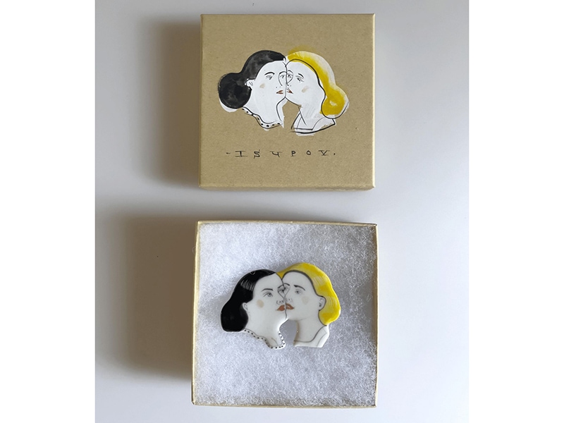 a brooch and it original box, by Russian ceramic artist Sergei Isupov 