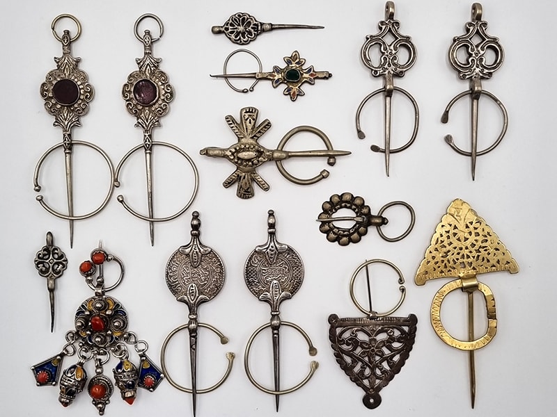 Fibulas (pins for fastening clothing) from Morocco, Algeria, and Tunisia, dating from the 1920s to the 1980s