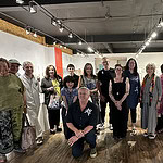 At Galerie Noel Guyomarc’h. Caption: (Front, kneeling) Mirei Takeuchi and Stéphane Blackburn, (back, left to right) Linda Shostak, Charlie Hayes, Noel Guyomarc’h, Edie Nadler, Despo Sophocleous, Maggie Erickson, Paul McClure, Catherine Granche, Catherine Sheedy, Susan Coddon, Linda Peshkin, Aurélie Guillaume, and Marie-Eve G. Castonguay