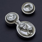 Tatjana Kutsõk, from the <em>Masquerade</em> series, 2024, earrings in silver, die-pressed cameos from CNC-milled aluminum molds, photo courtesy of the artist