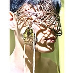 Yanpeng Xiao, <em>Mimicry,</em> 2024, face piece in gilding metal, biomaterials, cotton thread, photo courtesy of School of Jewellery, Birmingham City University | The mask piece hides the face while projecting the pattern onto the face, entangling natural form and human identity.