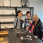 Susan Grant Lewin checking out work at Intro by Marzee gallery, with Danielle Gori-Montanelli and Barbara Berlin behind her, photo: Bill Baker