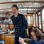 The captain of the 100-year-old boat cut a dashing figure, photo: Bill Baker