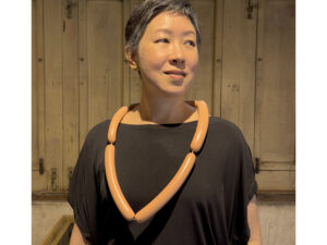 Atty Tantivit wearing Frankfurter necklace by David Bielander, photo courtesy of Atty Tantivit