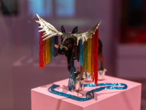 Felieke van der Leest (Netherlands, b. 1968), Rainbow Moose (Sculpture with Necklace) (edition of 3), 2005, polyester, plastic animal, 14-karat gold, silver, glass beads, epoxy resin, lead, object: 6 5/16 x 5 7/8 x 5 1/2 inches (160 x 150 x 140 mm), pendant: 7 7/8 x 6 5/16 x 1 15/16 inches (200 x 160 x 50 mm), Museum of Arts and Design, New York; gift of the Ron Porter and Joe Price Collection, 2022, shown in OUT of the Jewelry Box, Museum of Arts and Design, New York (April 20, 2024–April 12, 2026), photo: Jenna Bascom, courtesy of the Museum of Arts and Design