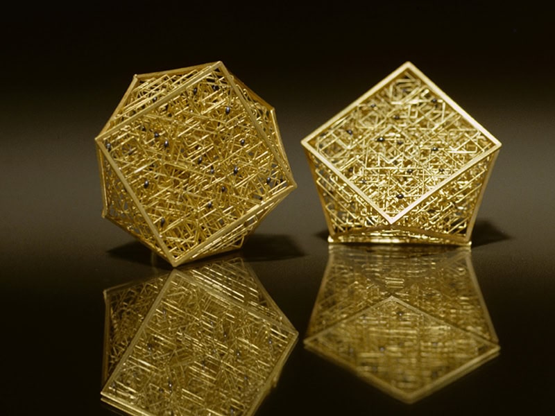 Giovanni Corvaja, Earrings, 1999, in 18-karat gold, niello, 1 ⅛ x 1 ⅛ x ¾ inches (30 x 30 x 20 mm), photo courtesy of Salotto SPJ