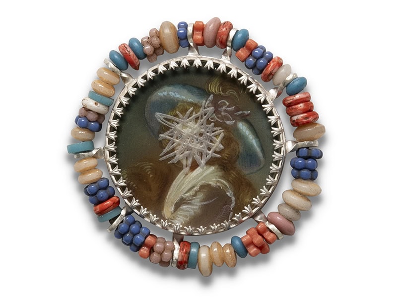 Geraldine Fenn, Colonial Comeuppance VII: De-Faced, 2024, brooch in silver, vintage portrait, glass, glass trade beads, steel pin, photo courtesy of the artist