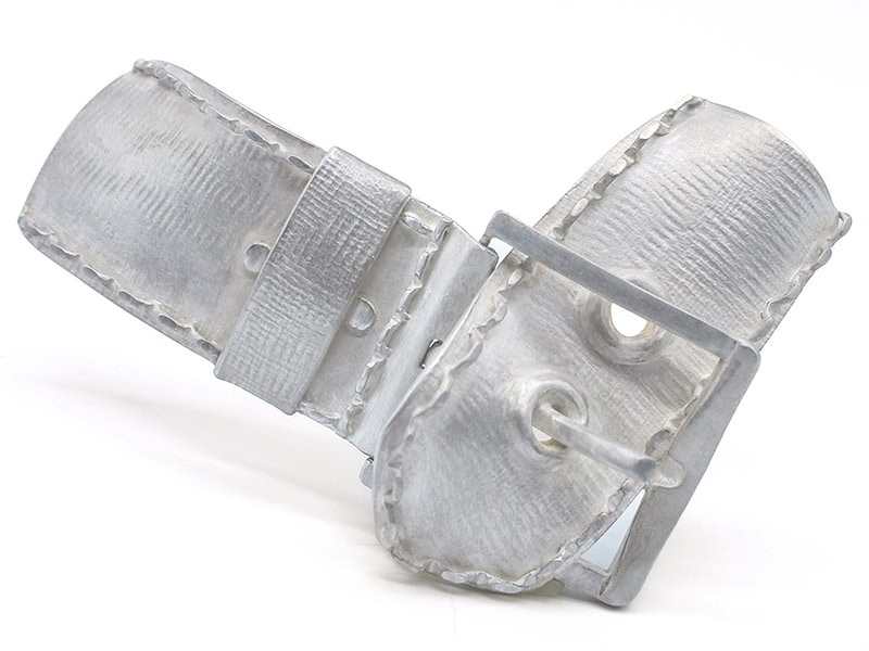 Megan Kerr, Buckling, 2025, brooch in sterling silver, steel, 3 x ⅝ x 1 ¾ inches (75 x 15 x 45 mm), photo courtesy of the artist