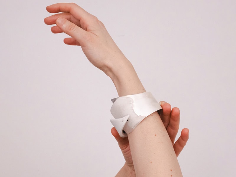 Iris Hummer, Shining through Change, 2025, bangle in porcelain, silver, rock crystal, 3 ⅛ x 3 ⅛ x 2 ⅜ inches (80 x 80 x 60 mm), photo: Nadja Spiegel
