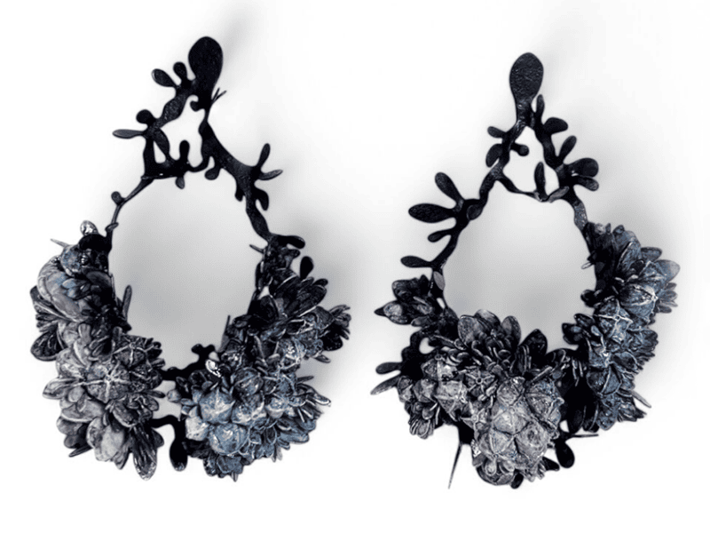 Hanna Liljenberg, Big Blue, 2025, earrings in paper, seed cases from linden, acrylic paint, lacquer, blackened brass, silver, photo courtesy of Thereza Pedrosa Gallery