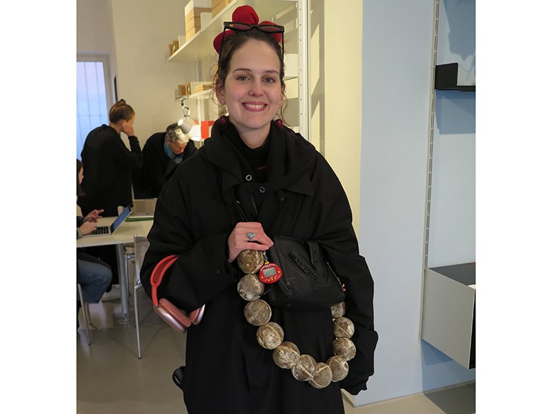 Martina Kocianova, artist and alumni of Central Saint Martins, with her mushroom balls attached to a handbag at the Cycles exhibition, photo: Kaia Ansip